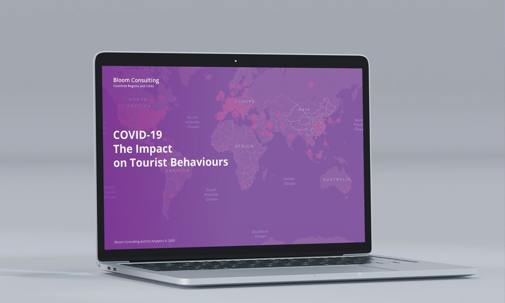 bloom_consulting_impact_tourist_behaviours laptop-worldmap