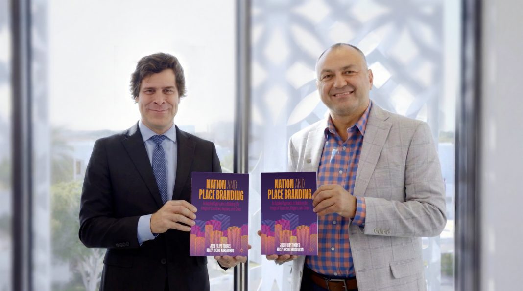 Authors_NYUBook Jose and Richie holding Nation and Place Branding book